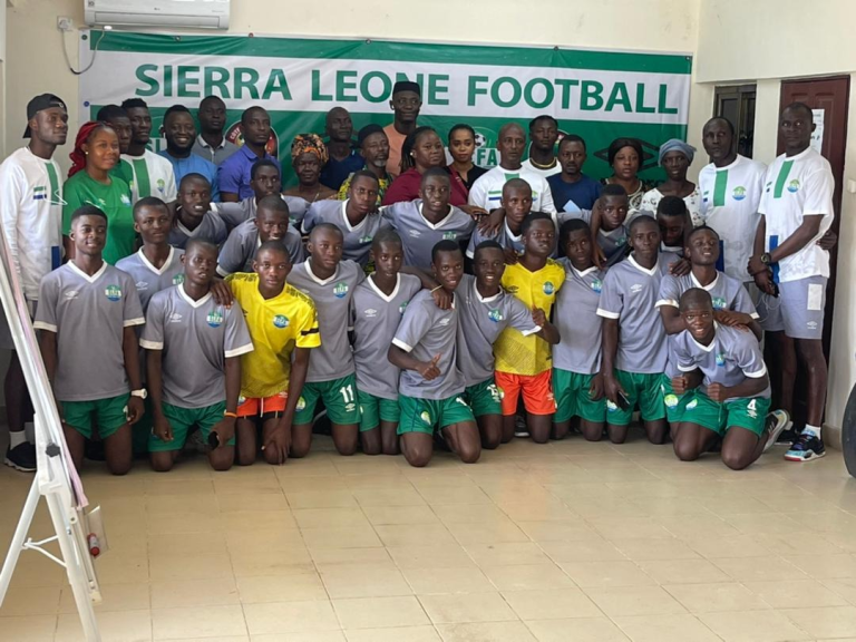 As SLFA Provides Parental Consent Forms For U-15 Male Team…Youth Football Coordinator Interacts With Parents